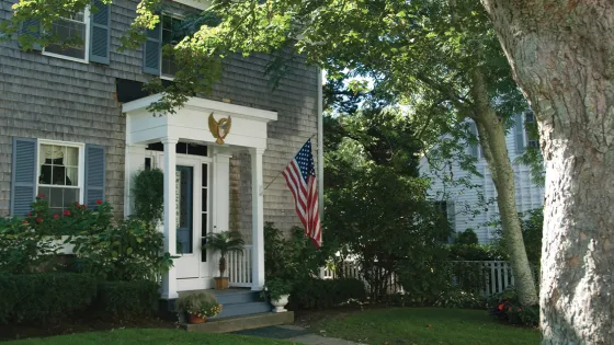 Front stoop and exterior of a grey suburban home