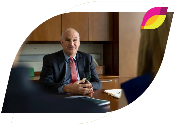 North Easton Savings Bank lender sitting at a desk and talking to clients