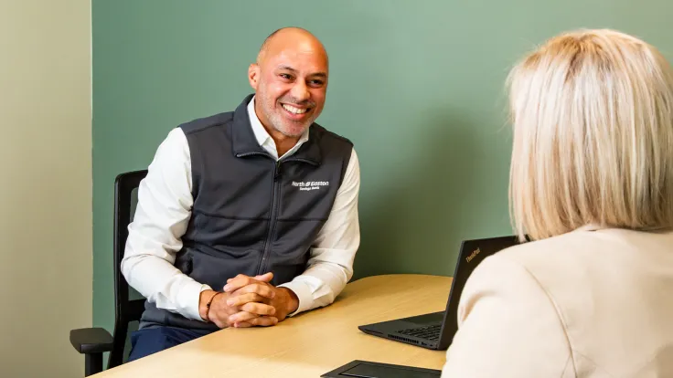 North Easton Savings Bank lender talking to a customer in an office