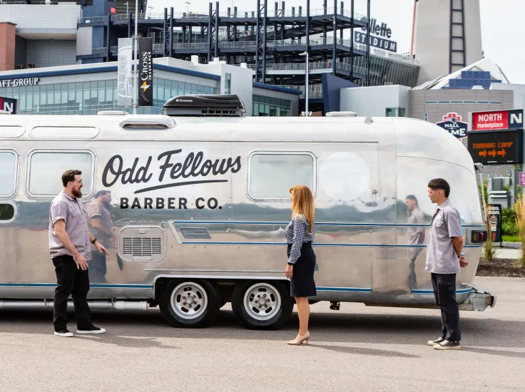 North Easton Savings Bank lending and two local partners standing in front of Odd Fellows Barber Co. airstream